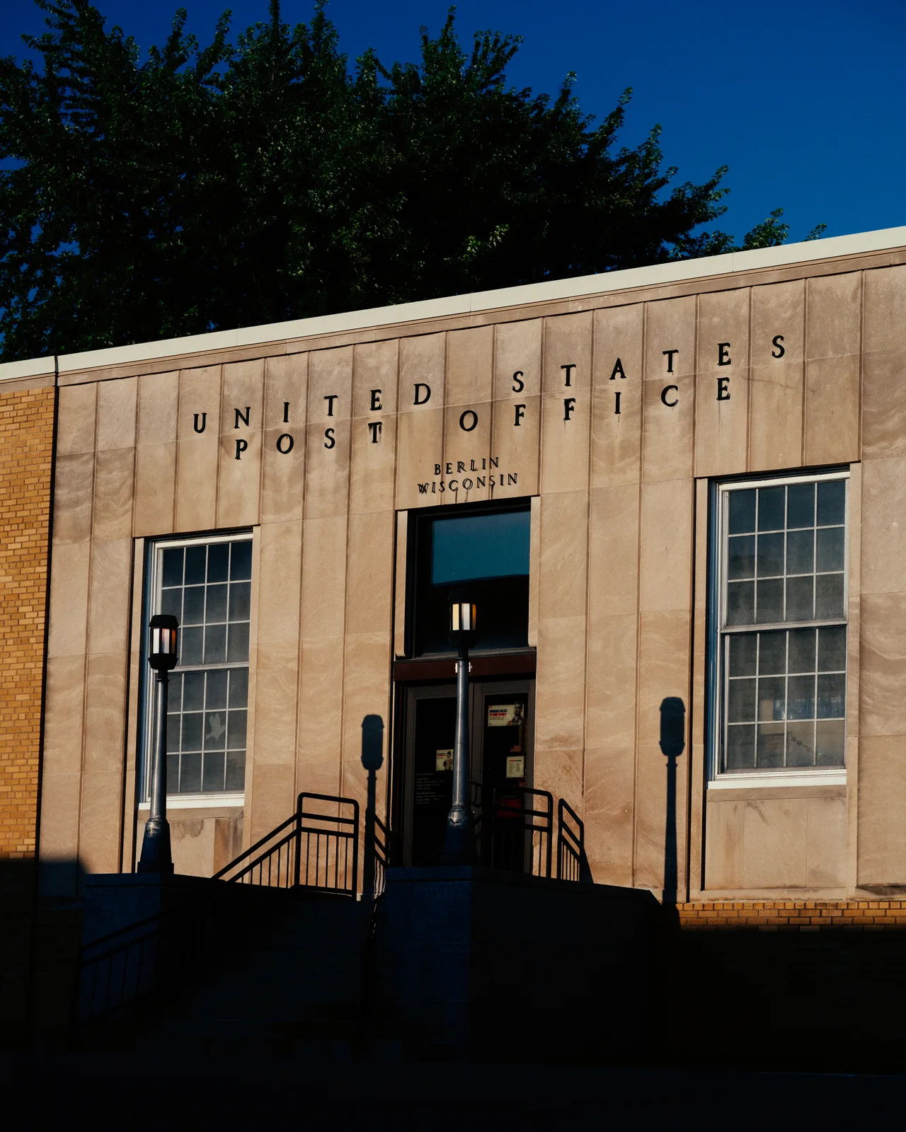 The Berlin, Wisconsin post office facade in late-afternoon light