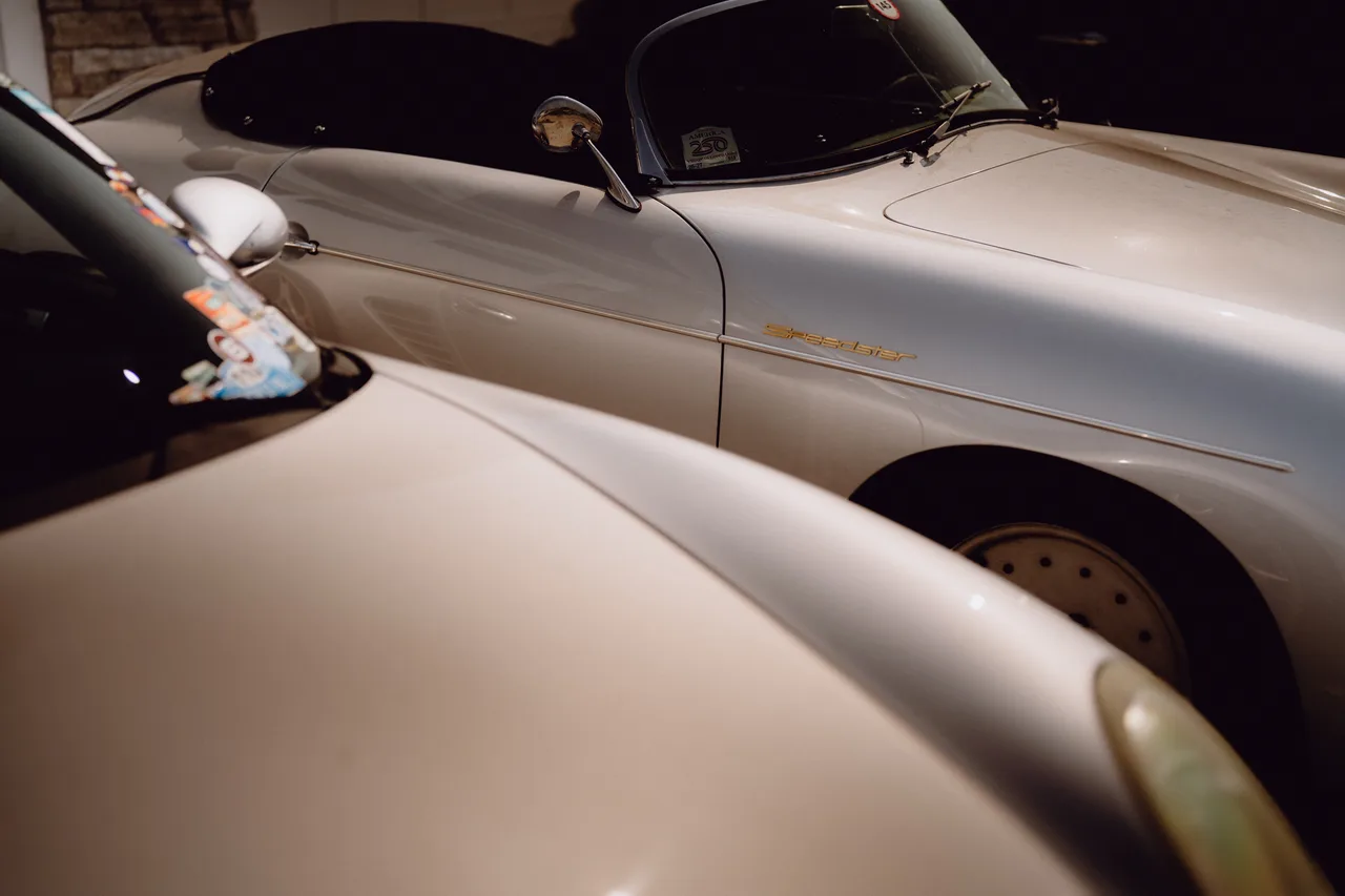 Curt Cromwell’s silver Porsche Speedster parked among other sports cars