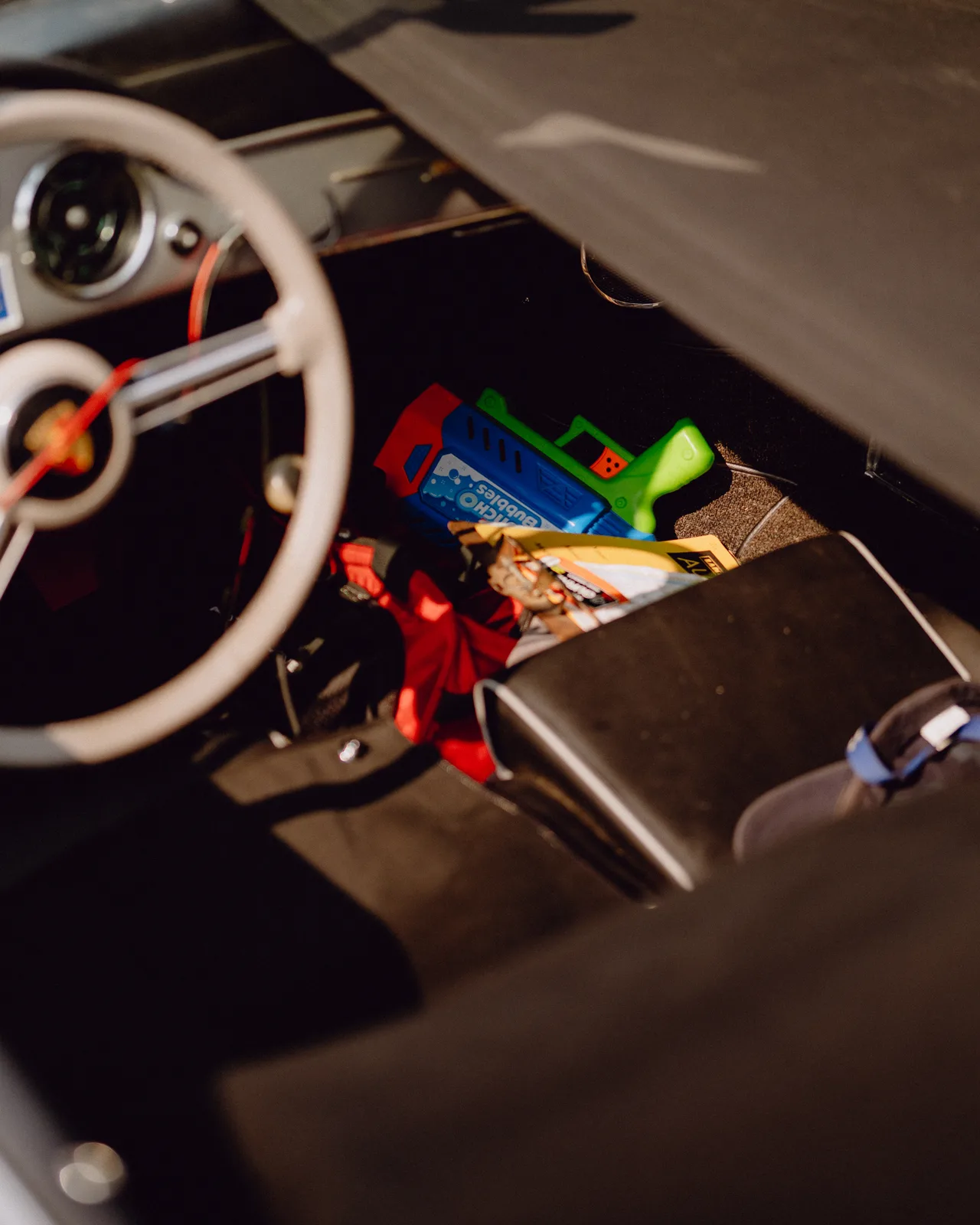 Road maps and personal items inside Curt Cromwell’s Porsche Speedster