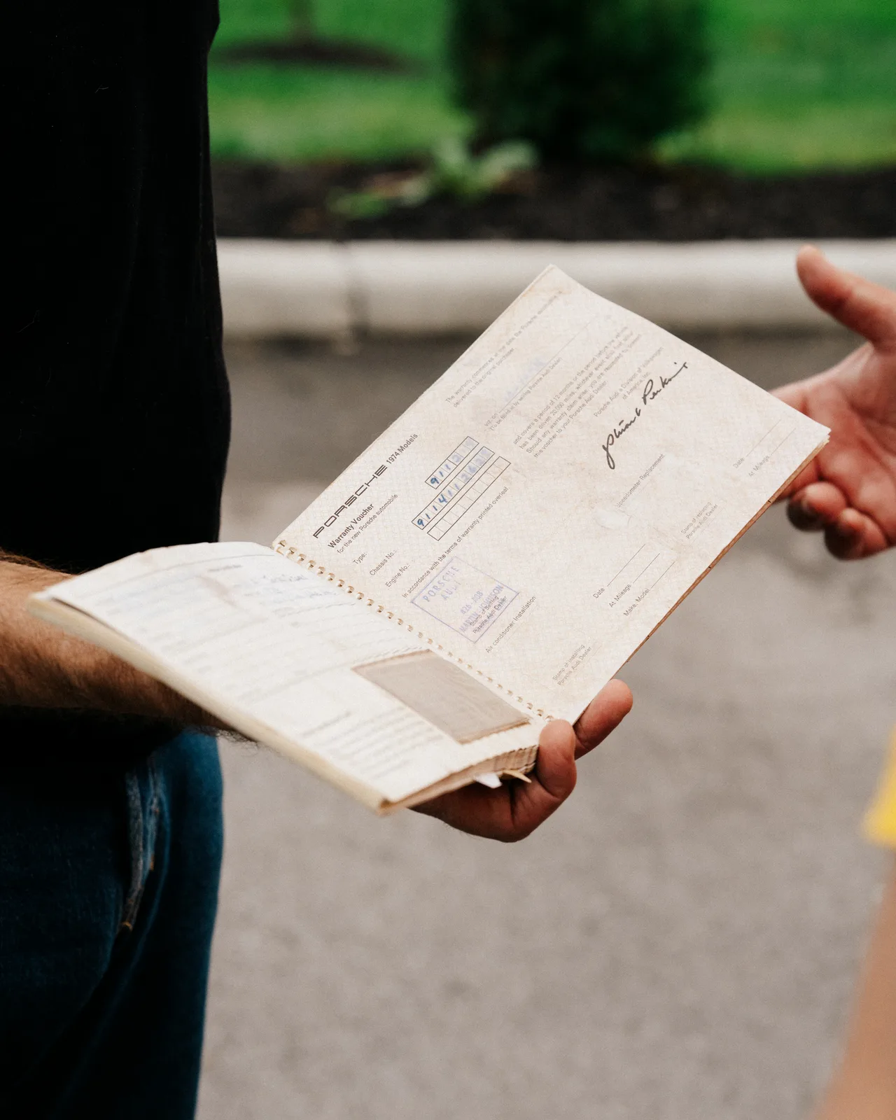 An attendee holding open an Off the Map book to a route illustration
